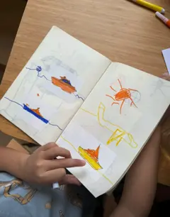 Customer photo: Stickr boat prints stuck in a drawing book