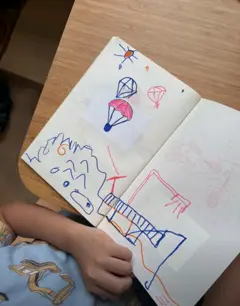 Customer photo: a Stickr hot-air balloon print in a drawing book